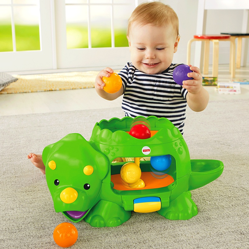 FISHER PRICE muzyczny DINOZAUR DINO KULECZKI PIŁKI