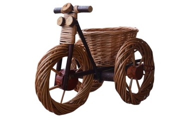 Wicker bicycle bright flowerbed on flowers garden, фото